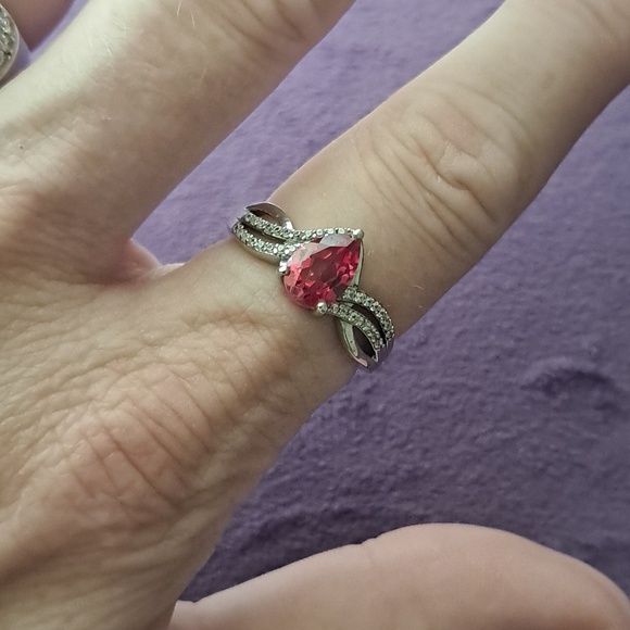 Jewelry - Padparadscha Sapphire & White Zircon Accented Triple Shank Ring.